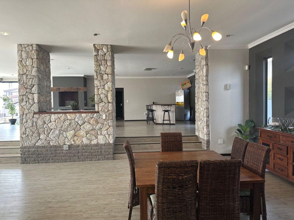 View from kitchen to dining room and entertainment area.