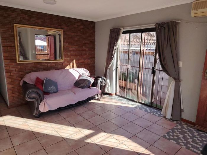 To Rent: House in Protea Heights with 3 bedrooms, garage, and enclosed backyard.