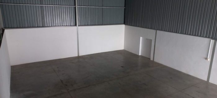 Industrial warehouse to rent in Fairview with security, roller door access, and office.