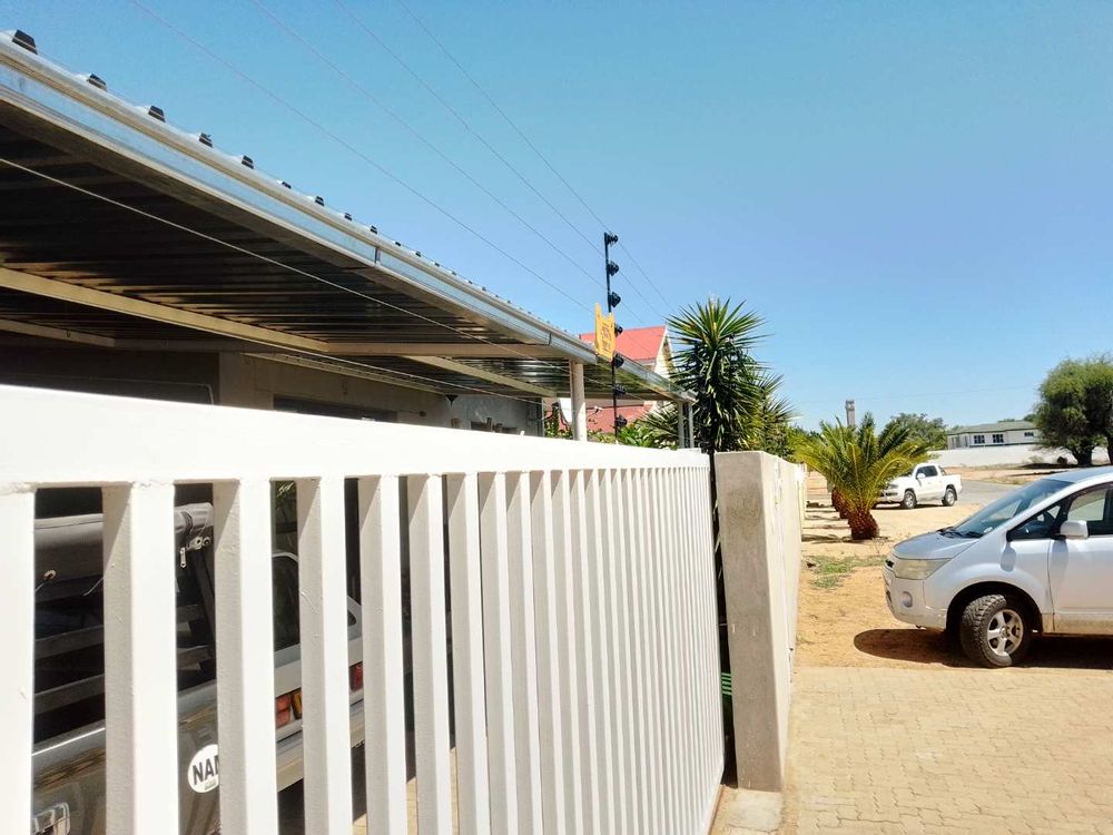 Note electrical fence and electronically operated entrance gate. 