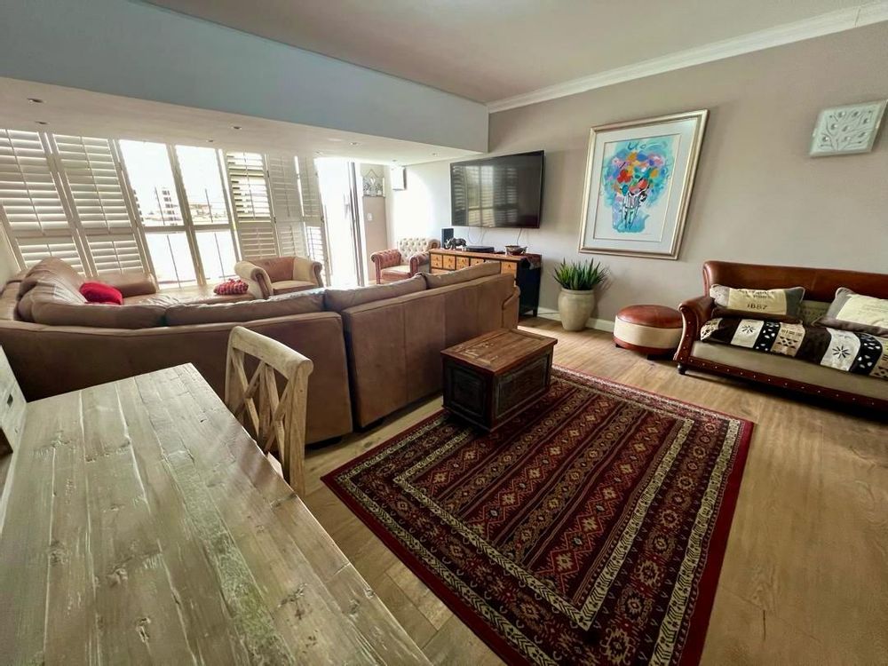Lounge with door leading to the front patio