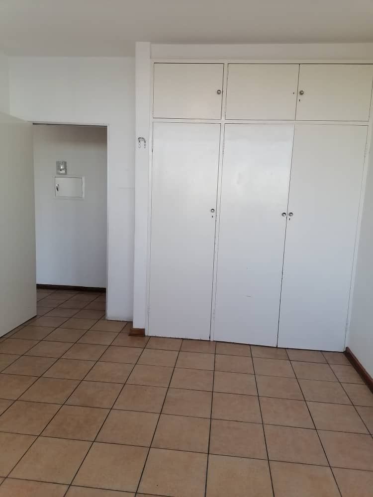 BEDROOM WITH BUILT-IN CUPBOARDS