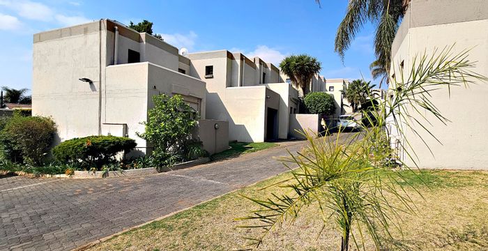 Radiokop Townhouse For Sale: Open plan living, garage access, private garden, communal pool.