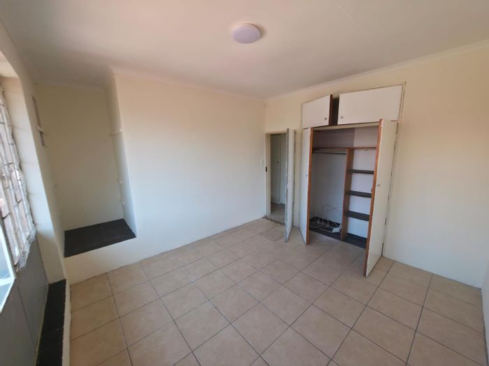 2-Bedroom Townhouse in Pretoria North For Sale with laundry, parking, and braai area.