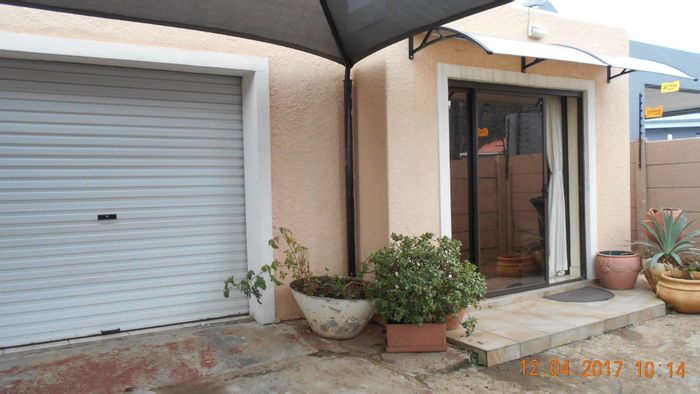 House To Rent in Florentia: Two bedrooms, garage, shared driveway, small garden.