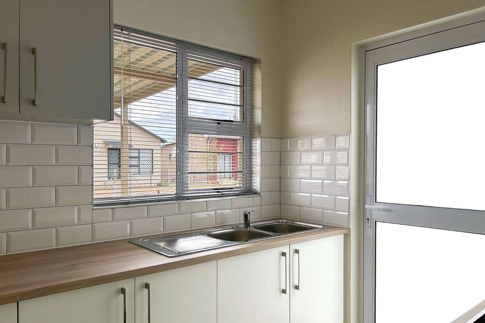 Modern kitchen with built-in cupboards and built-in oven.