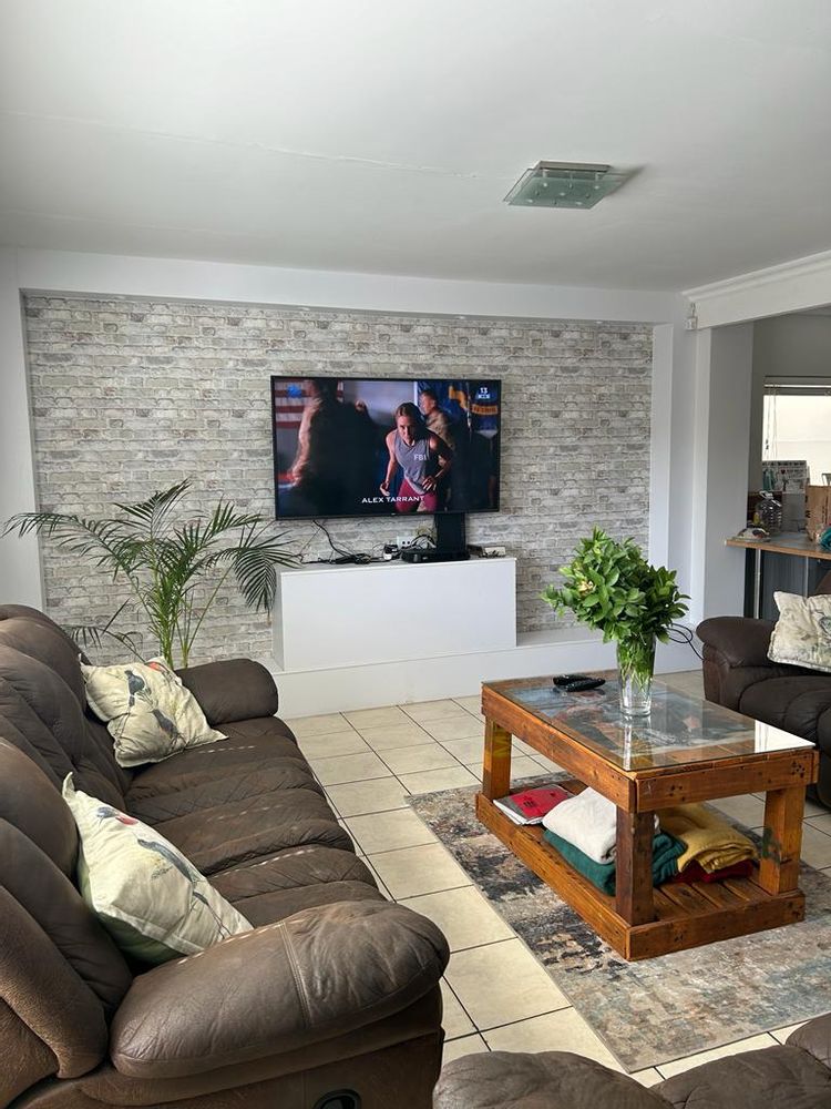 TV area - with open plan kitchen