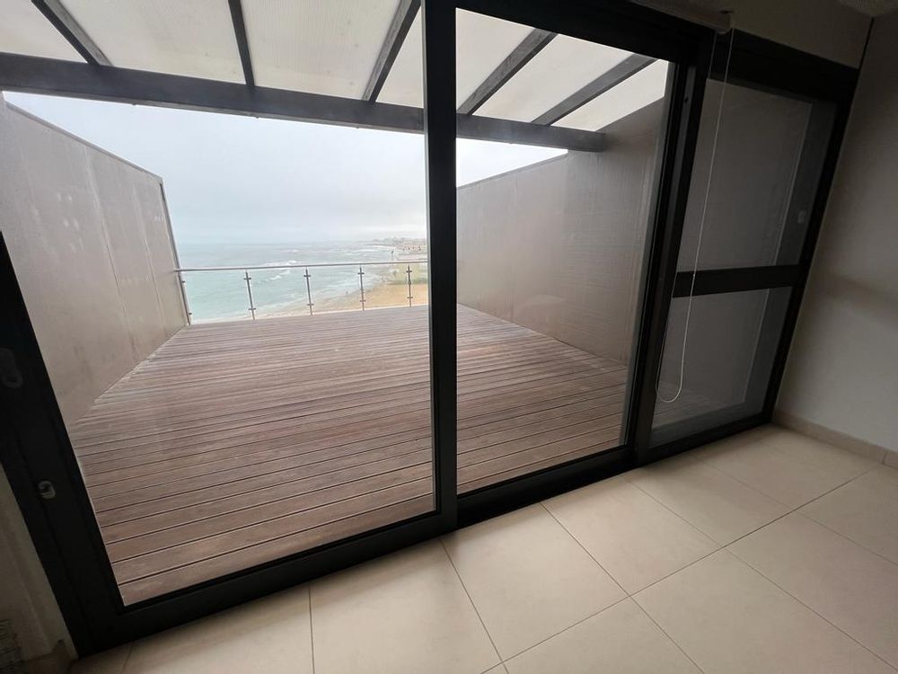 Deck which leads from the Lounge/dining area with sliding doors