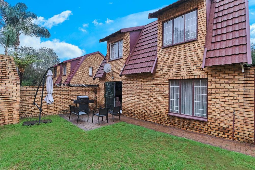 Back yard with built-in-braai and open patio