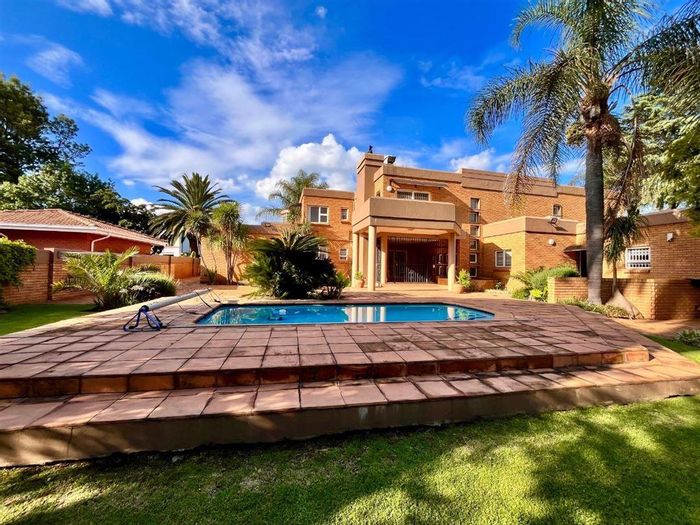 Spacious 5-bedroom house with pool, flatlet, and entertainment areas in Sunward Park. For Sale.