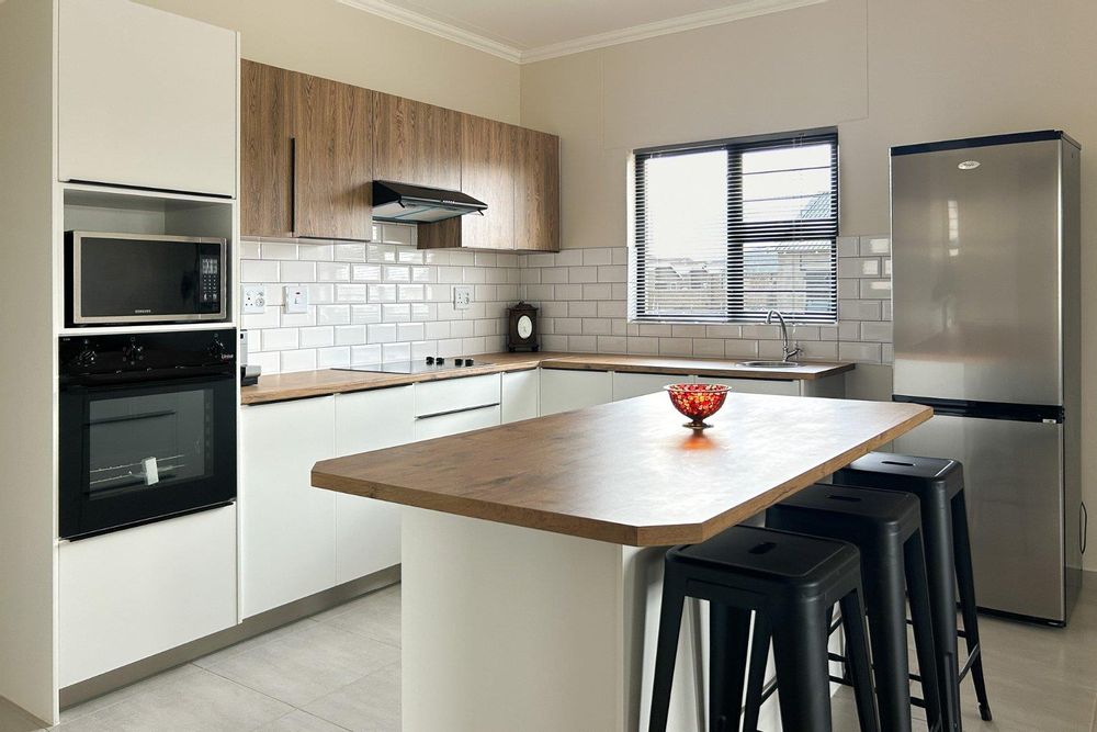 Modern kitchen island with scullery.