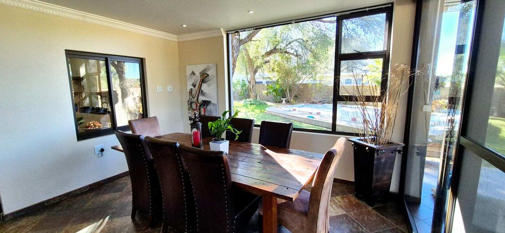 Sunny Sitting area overlooking the beautiful garden and swimming pool