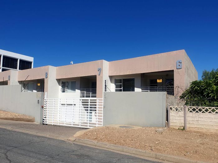 For Sale: Apartment in Windhoek Central with rental income, garage, and balcony.