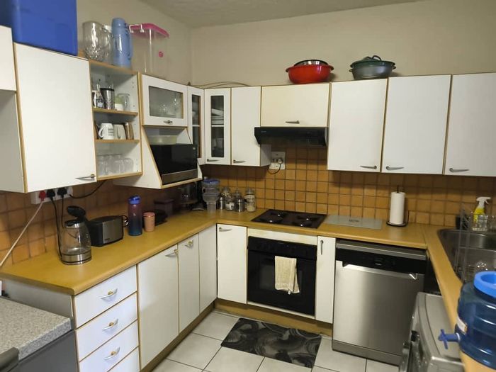 For Sale: Townhouse in Suiderhof with private garden, double carport, and braai area.