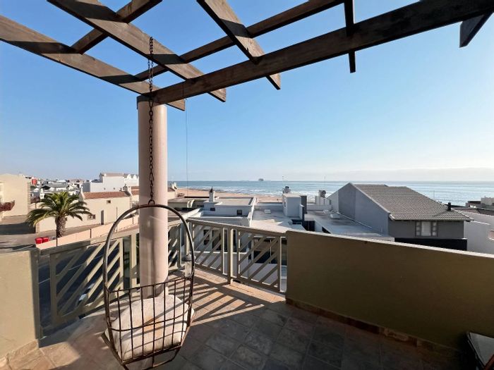 Coastal apartment for sale in Long Beach: 3 beds, 2 baths, ocean views.