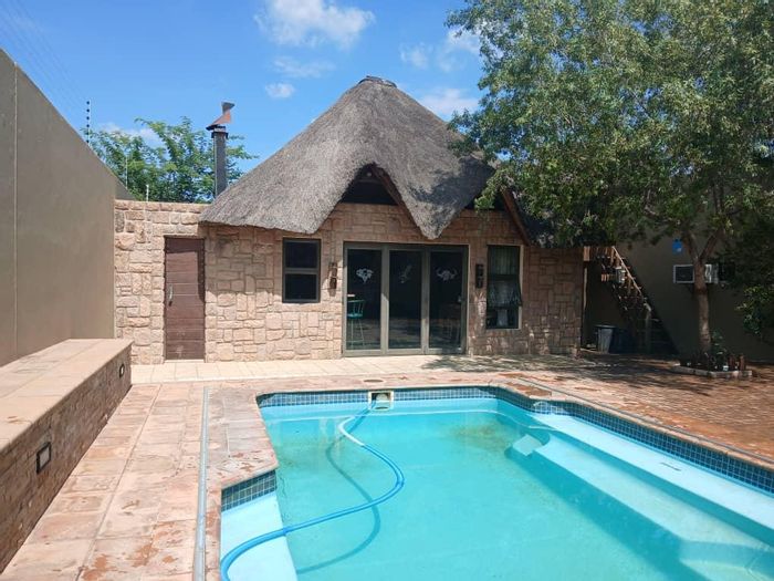 Pioniers Park House For Sale: Family home with flat, pool, and security features.