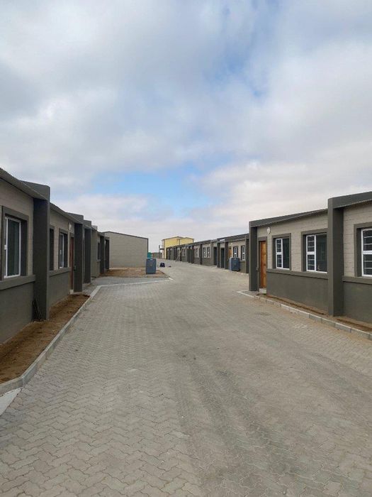 Townhouse for Sale in Walvis Bay Central: 2-bed, pet-friendly, secure living, green spaces.