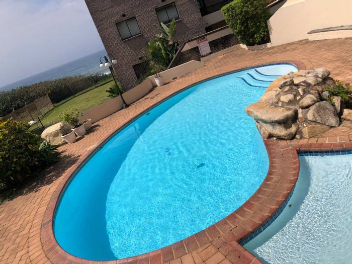 For Sale: Uvongo Apartment with beach access, pool, braai area, and security.