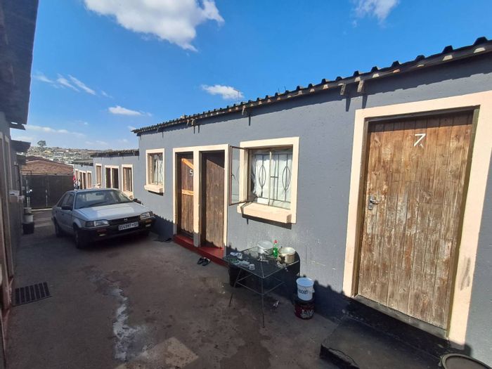For Sale: Ivory Park House with 12 rented rooms, secure parking, and prepaid electricity.