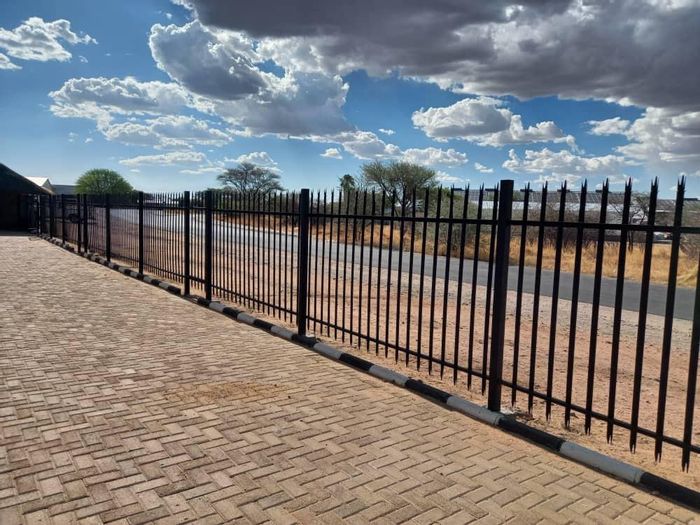 Industrial Property For Sale in Okahandja Central: Versatile spaces, secure amenities, expansive erf.