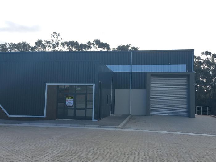 Industrial warehouse in Fairview to rent with office, retail space, and roller door access.