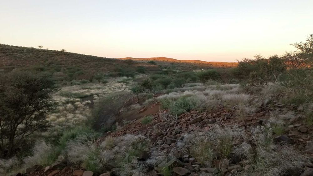 Rocky/ grassland hilltop and beautiful sunset