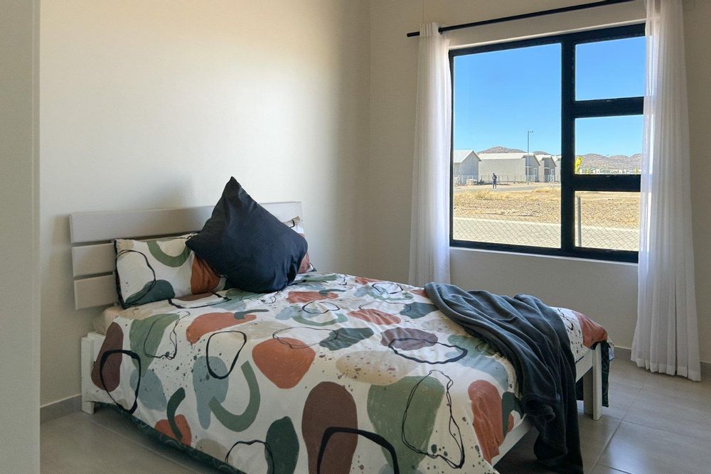 Third bedroom with built-in cupboards.