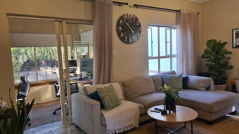 Lounge and study with blinds throughout the home