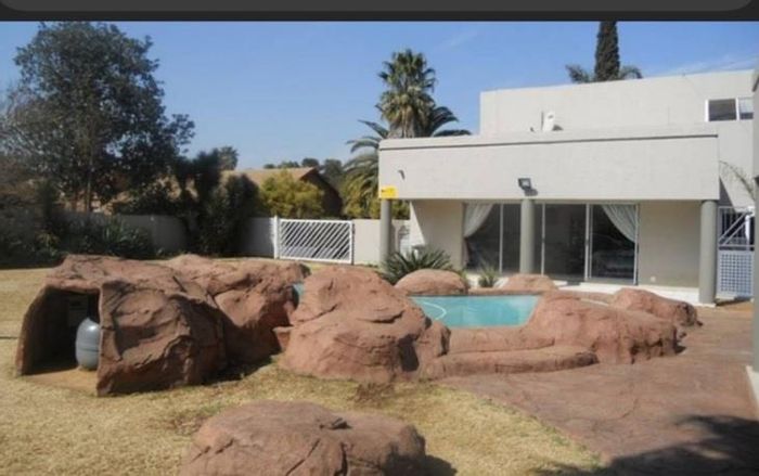 Spacious Sunward Park house for sale with pool, patio, and double garage.