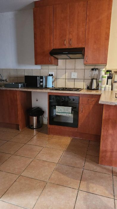 Ground floor apartment in Theresapark with 24-hour security and carport. For Sale.