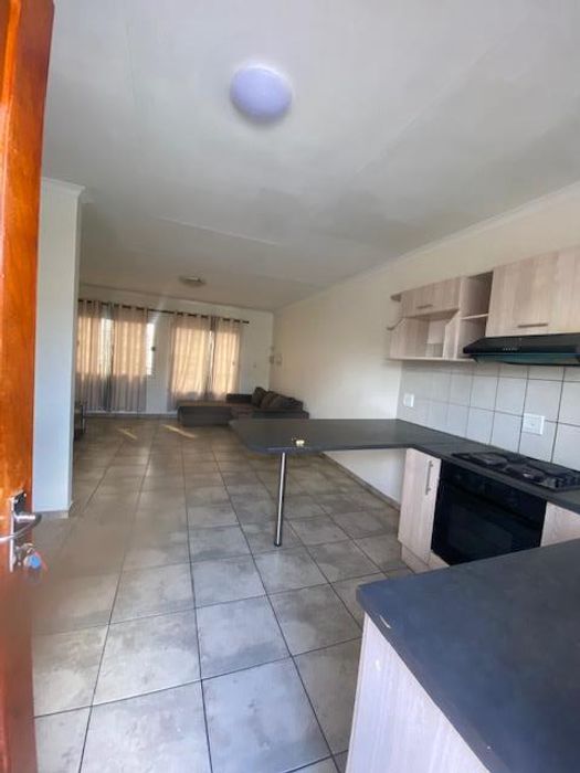 For Sale: Apartment in Windhoek North with parking, security, and tenant income.