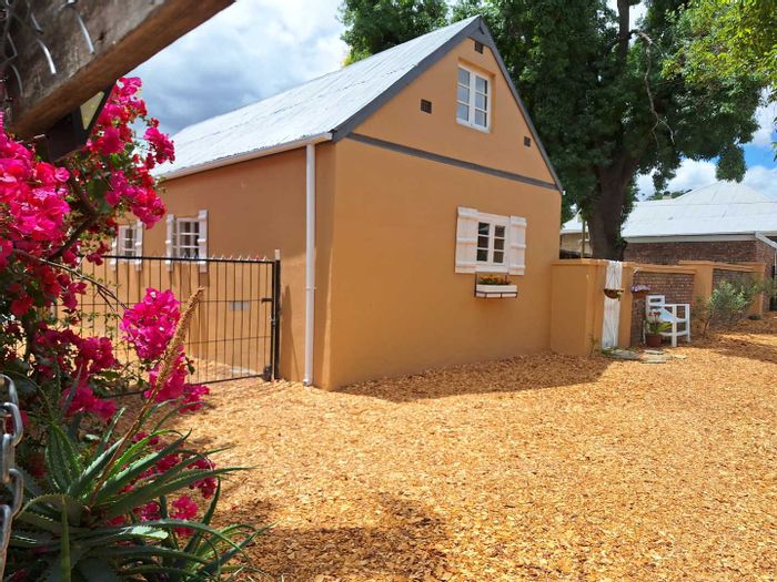 Charming Oudtshoorn Central house with guesthouse potential, attic bedroom, and private garden. For Sale.