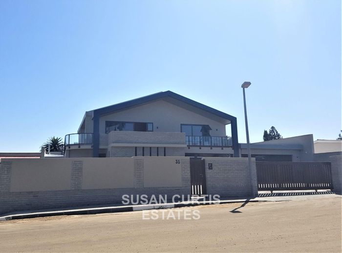 House for Sale in Swakopmund Central: Indoor garden, entertainment room, security features.