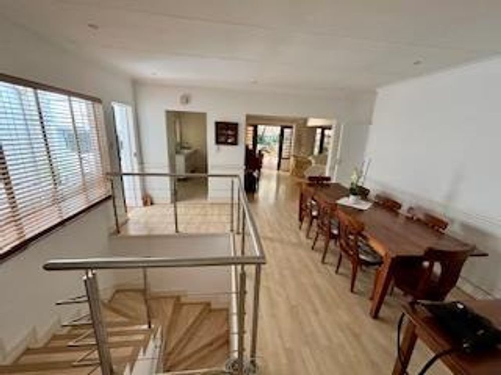 Dining room at top of stairs flowing into the lounge and onto the patio 