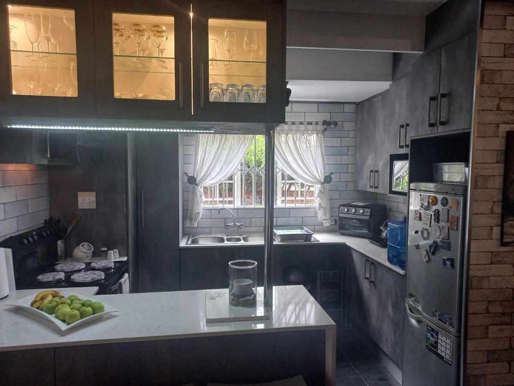 neat kitchen with lots of cupboards