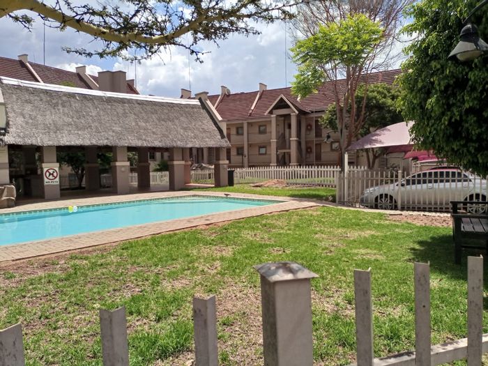 Sundowner Apartment For Sale: 1-bed, loft space, pool access, near Northgate Mall.