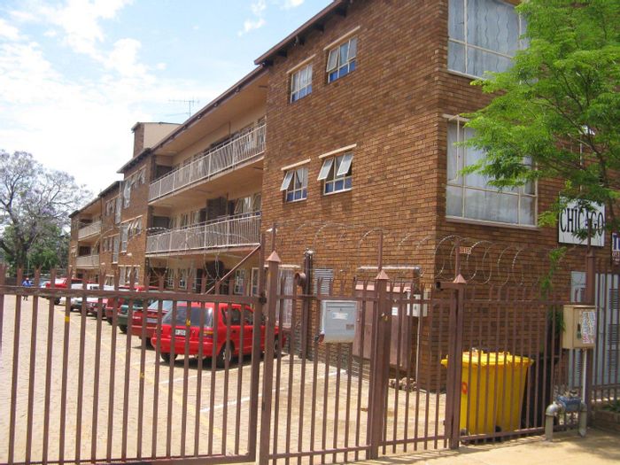 Spacious Pretoria West apartment to rent, near schools, shops, and transport.