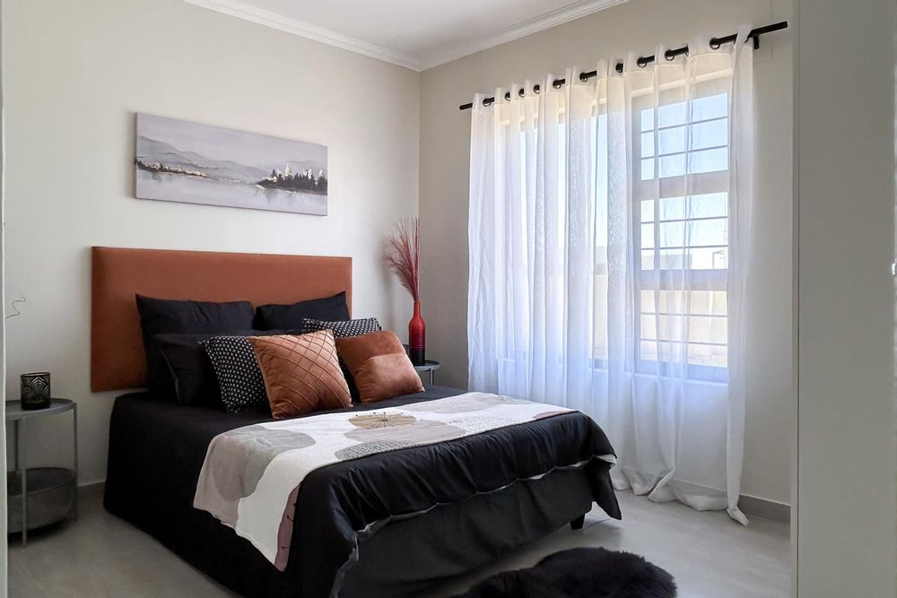 Third bedroom with built-in cupboards.