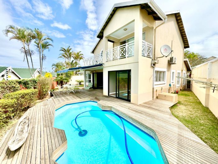 For Sale: Townhouse in Umhlanga Central with pool, garden, and solar panels.