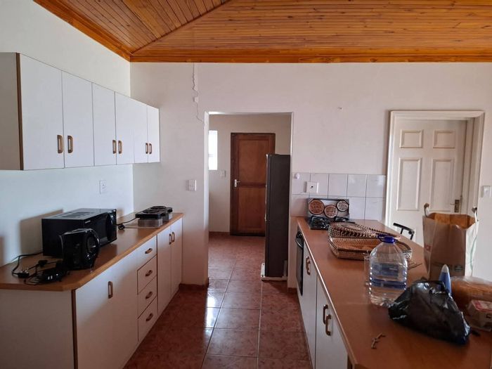 For Sale: Henties Bay Central House with 2 beds, double garage, and scullery.