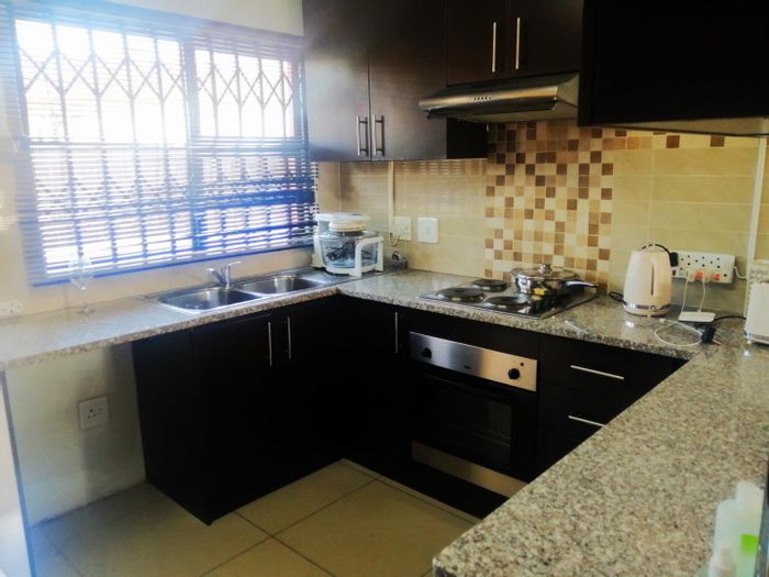 3-Bedroom Townhouse in Brackendowns For Sale with parking, air conditioning, and prepaid electricity.