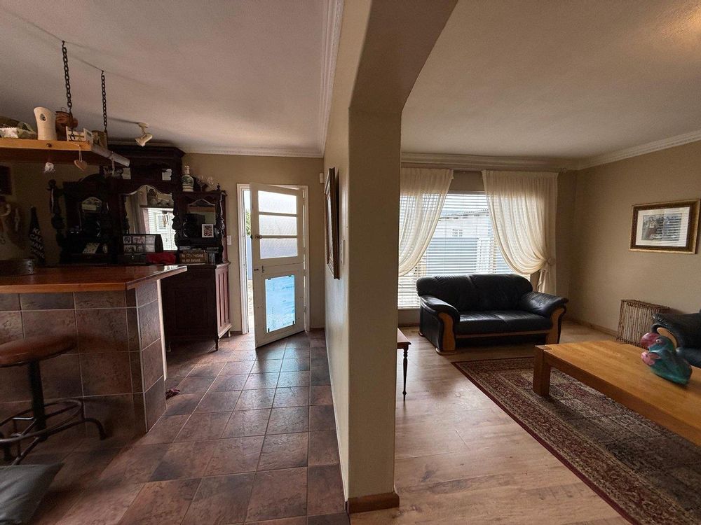 Lounge, bar and door leading to the back yard