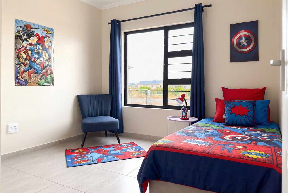 Second bedroom with built-in cupboards.