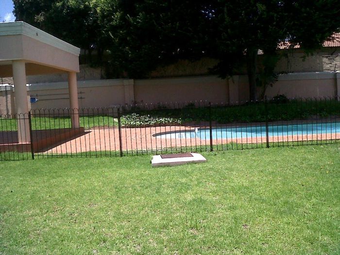 To Rent: Sandown Apartment with pool, security, balcony, and carport.