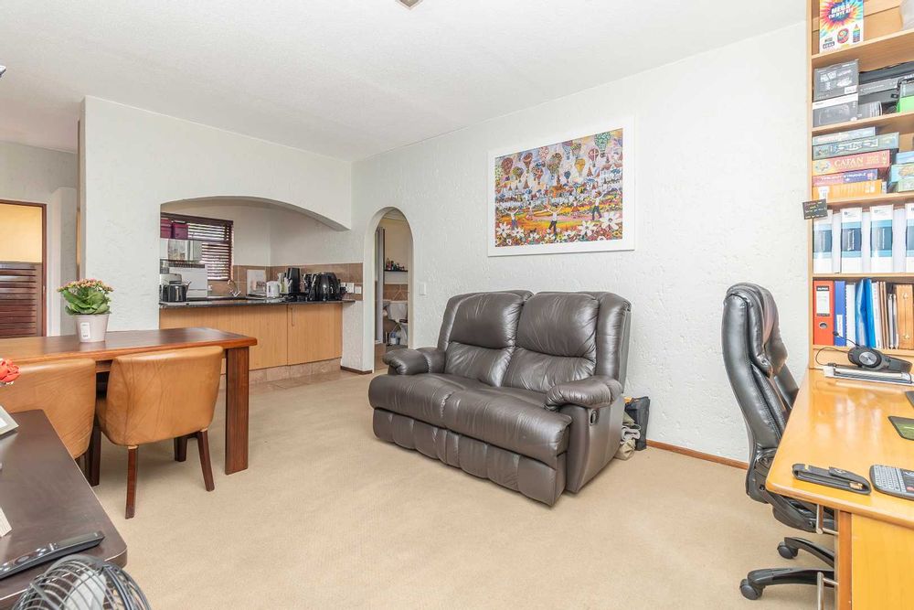 Living area set up as lounge with dining and study space