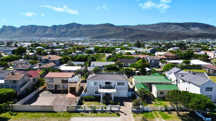 For Sale: Spacious 5-bedroom house in Sandbaai with ocean views and private garden.