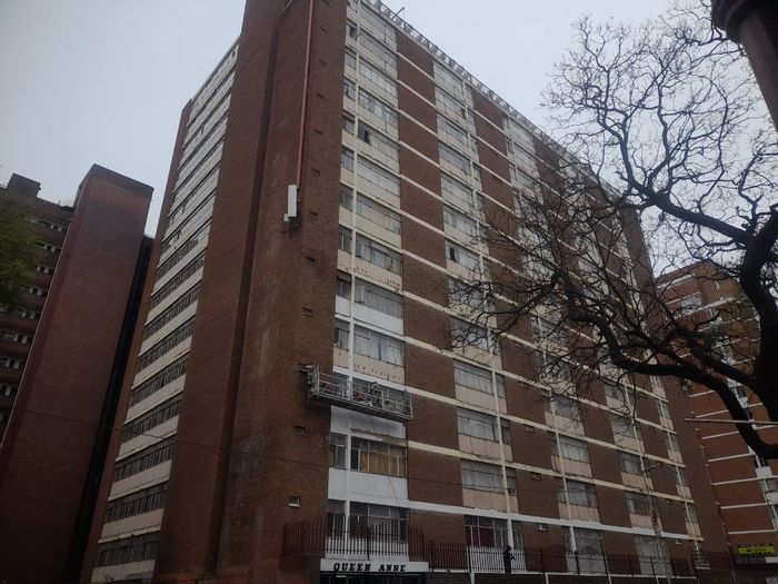 Hillbrow Apartment For Sale: Bachelor unit, secure block, basement parking, rental income potential.