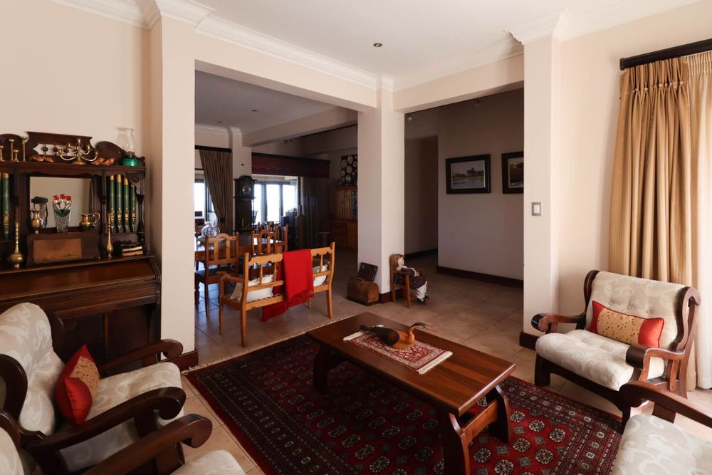 Lounge adjacent to dining area and entry way