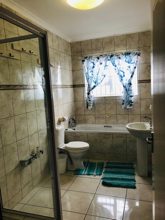 Ocean View House For Sale: Income potential with two rental flats and security features.