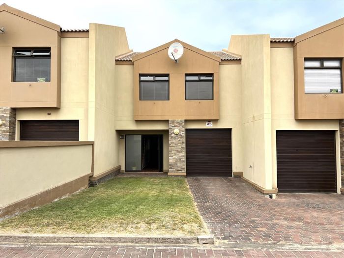 Townhouse For Sale in Dolphin Beach: 3 bedrooms, indoor BBQ, single garage.